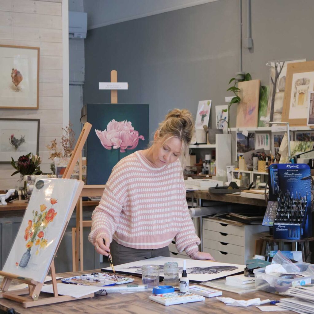 Jodie painting in studio space