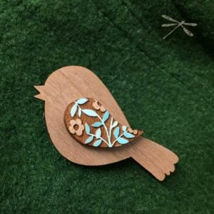 bird brooch coat